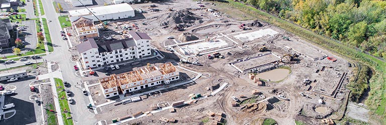 Aerial photograph of an apartment complex under construction