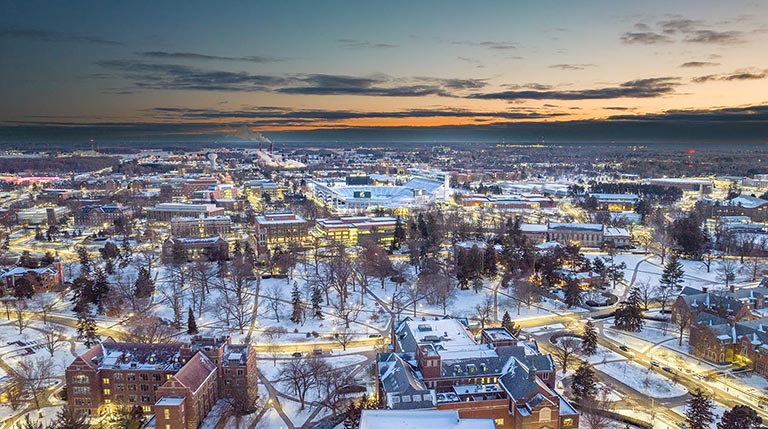 Aerial view of Michigan State University at sunset after a heavy snow