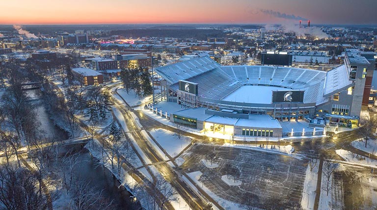 Aerial view of MSU Spartan Stadium at sunset after a heavy snow