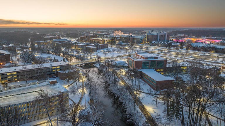 Aerial view of Michigan State University at sunrise after a heavy snow